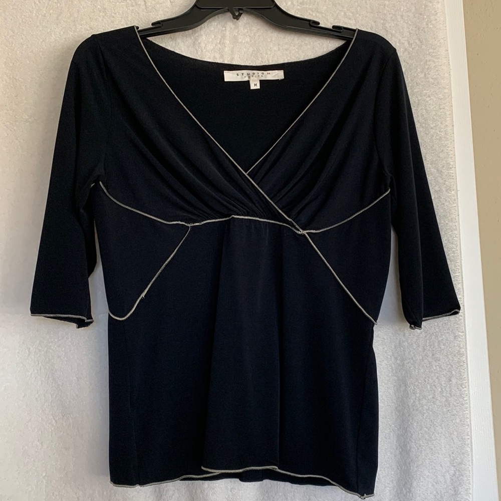 Studio M top. Crisscross bodice with white trim. Excellent condition